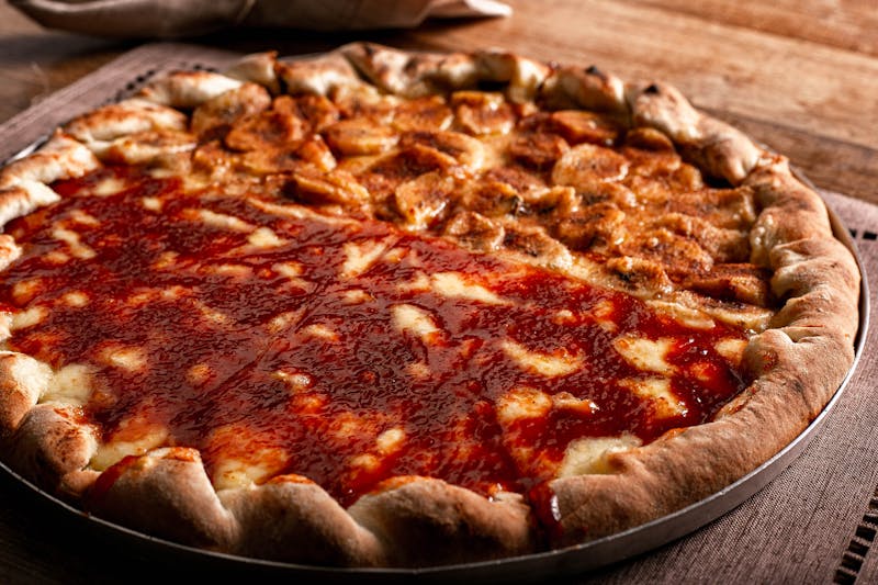 Four cheese deep dish pizza golden and bubbly