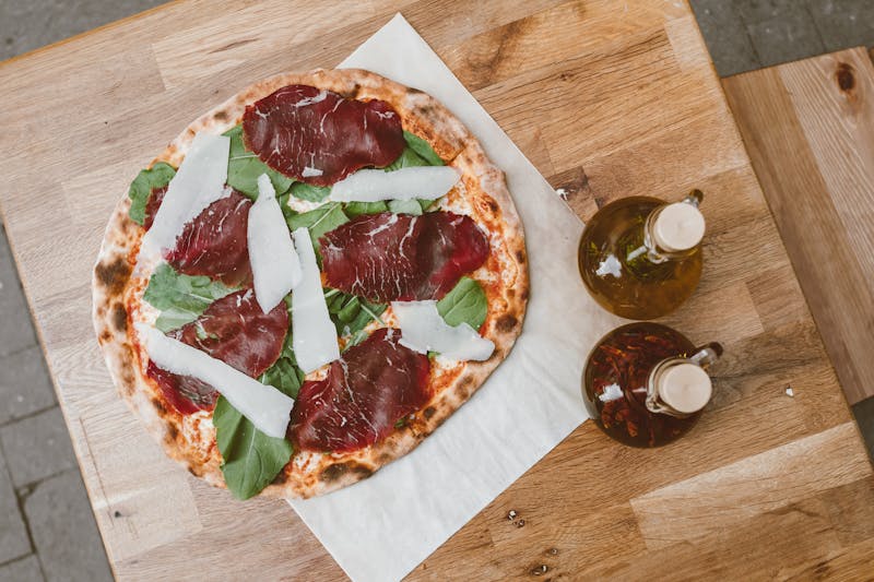 Truffle mushroom pizza with arugula and shaved parmesan