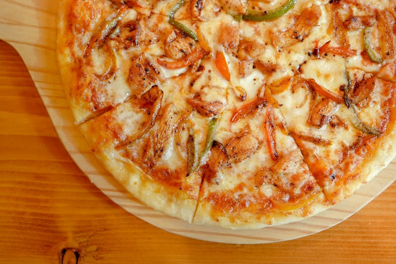 Deep dish pizza with mushrooms and bell peppers